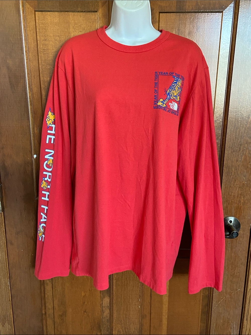 The North Face long-sleeve graphic t-shirt featuring a "Year of the Tiger" large